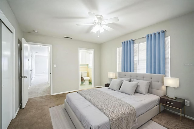 2307 Freemason St, Lakeland, FL 33801 - carpeted bedroom with ensuite bath, ceiling fan, and a closet