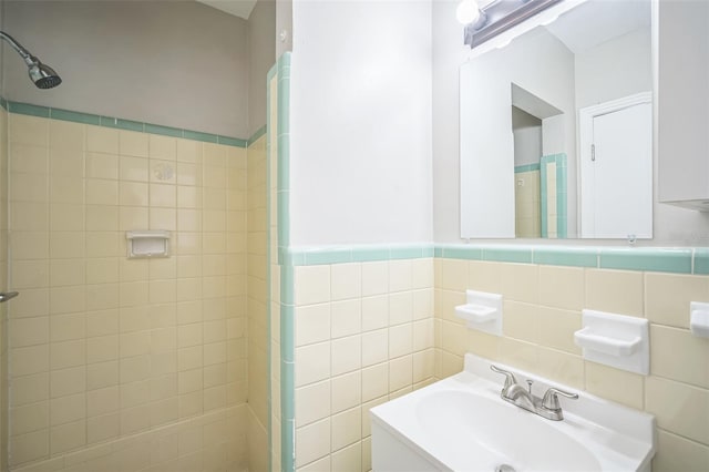 2307 Freemason St, Lakeland, FL 33801 - full bathroom with a shower stall, tile walls, and vanity