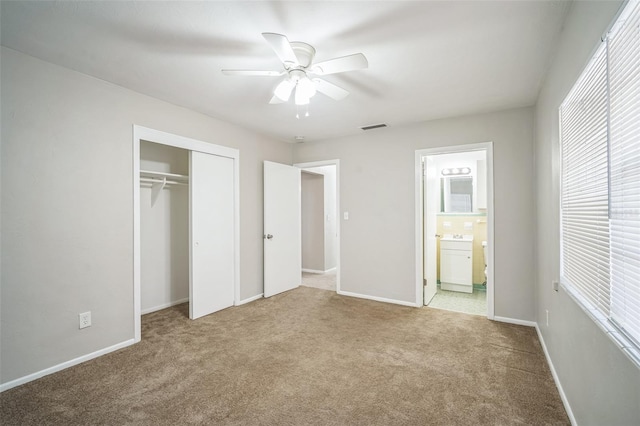 2307 Freemason St, Lakeland, FL 33801 - unfurnished bedroom with carpet flooring, a closet, ensuite bath, and a ceiling fan