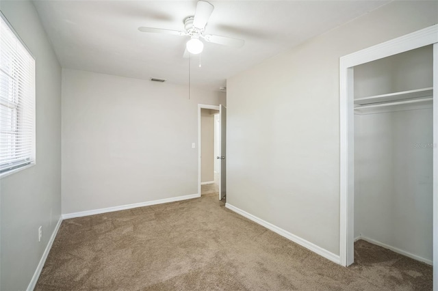 2307 Freemason St, Lakeland, FL 33801 - unfurnished bedroom with carpet floors, a closet, and ceiling fan