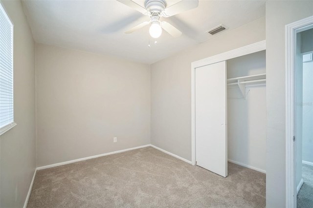 2307 Freemason St, Lakeland, FL 33801 - unfurnished bedroom featuring carpet, a closet, and ceiling fan