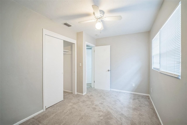 2307 Freemason St, Lakeland, FL 33801 - unfurnished bedroom featuring carpet, a closet, and a ceiling fan