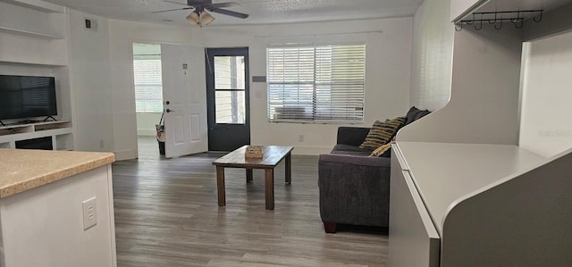 320 Forestway Cir Unit 107, Altamonte Springs, FL 32701 - living room featuring ceiling fan and wood finished floors