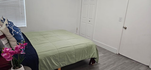 320 Forestway Cir Unit 107, Altamonte Springs, FL 32701 - bedroom featuring wood finished floors