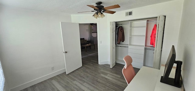 320 Forestway Cir Unit 107, Altamonte Springs, FL 32701 - office space featuring ceiling fan, wood finished floors, and a textured ceiling