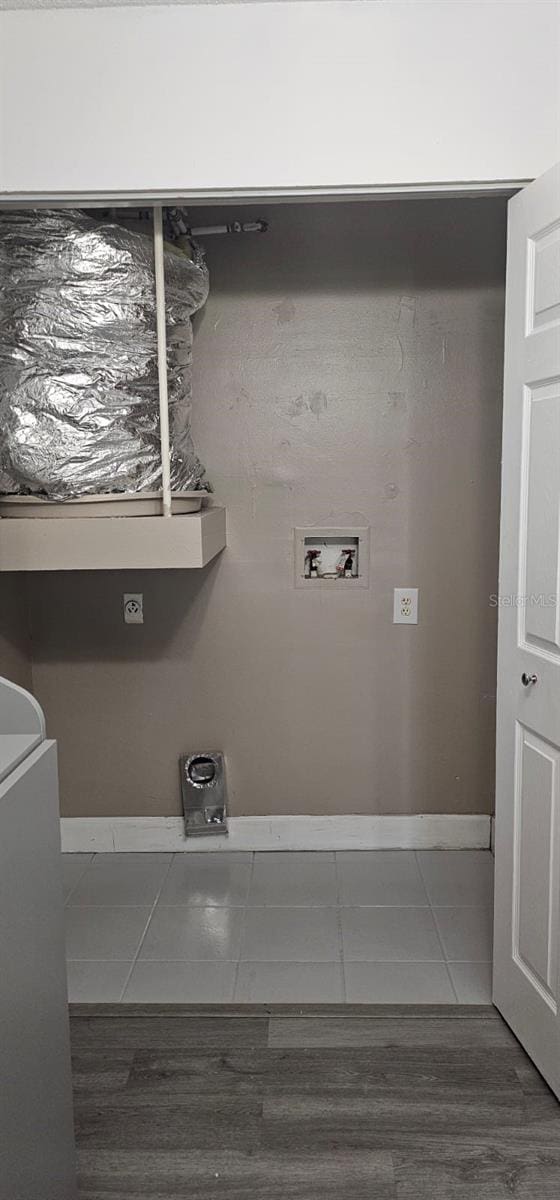 320 Forestway Cir Unit 107, Altamonte Springs, FL 32701 - laundry room with hookup for a washing machine, wood finished floors, and electric dryer hookup
