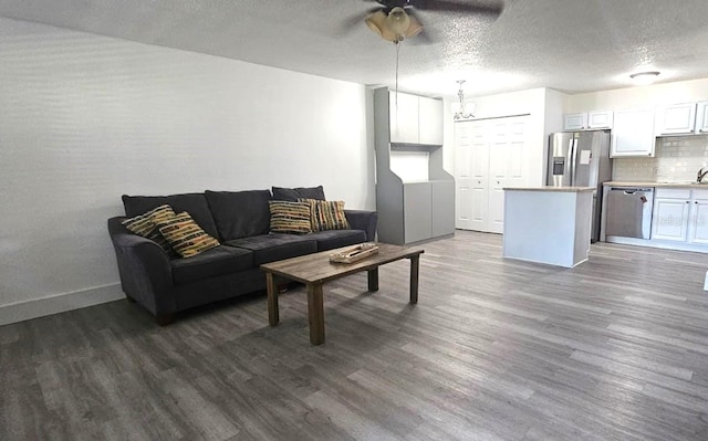320 Forestway Cir Unit 107, Altamonte Springs, FL 32701 - living area featuring dark wood-style flooring, ceiling fan, and a textured ceiling