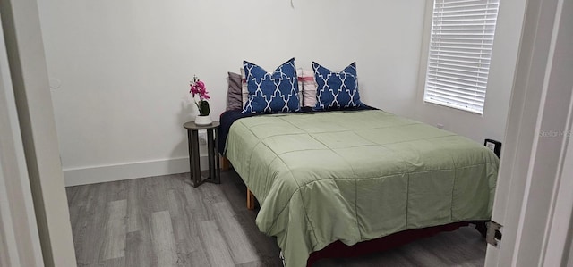 320 Forestway Cir Unit 107, Altamonte Springs, FL 32701 - bedroom featuring wood finished floors and baseboards