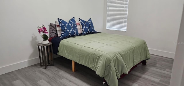 320 Forestway Cir Unit 107, Altamonte Springs, FL 32701 - bedroom with wood finished floors and baseboards