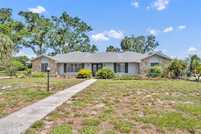 1115 Lake Francis Dr, Apopka, FL 32712 - view of front of property featuring stone siding, a front lawn, and french doors