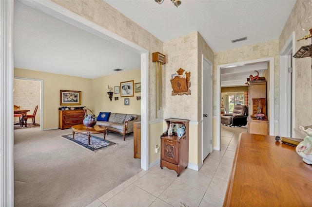1115 Lake Francis Dr, Apopka, FL 32712 - hallway featuring light tile patterned floors, baseboards, and light colored carpet