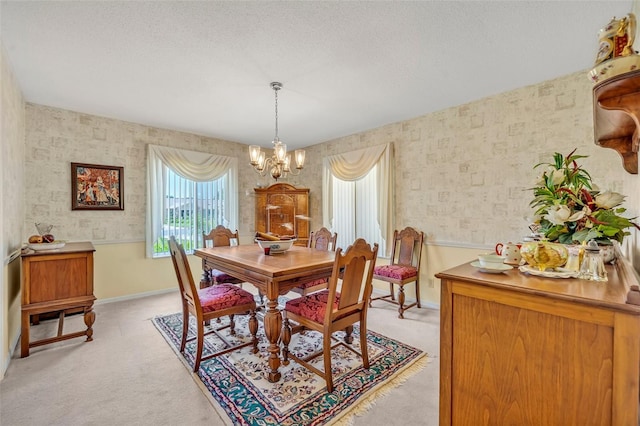1115 Lake Francis Dr, Apopka, FL 32712 - dining area with a chandelier, light carpet, baseboards, wallpapered walls, and a textured ceiling