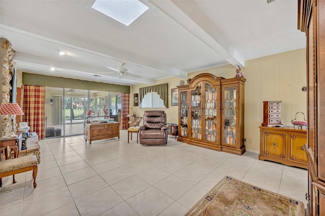 1115 Lake Francis Dr, Apopka, FL 32712 - sitting room featuring beamed ceiling, ceiling fan, light tile patterned floors, and a skylight