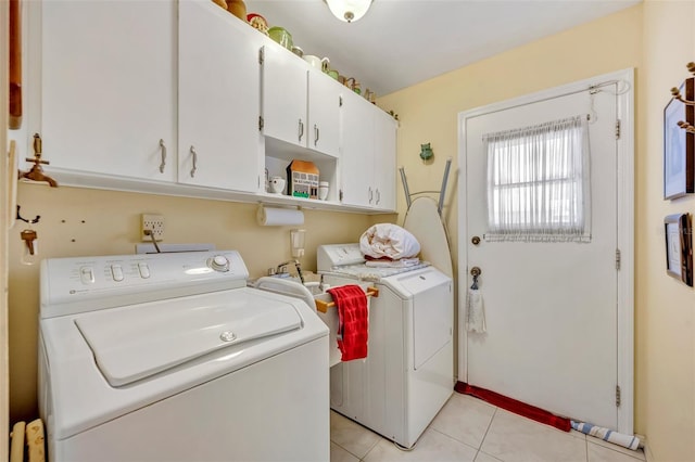 1115 Lake Francis Dr, Apopka, FL 32712 - laundry room featuring washer and clothes dryer, cabinet space, and light tile patterned floors