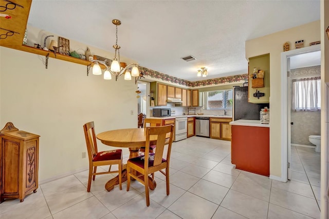 1115 Lake Francis Dr, Apopka, FL 32712 - dining room featuring light tile patterned floors, baseboards, and a chandelier