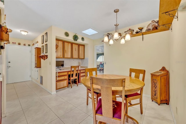 1115 Lake Francis Dr, Apopka, FL 32712 - dining room featuring light tile patterned floors, a skylight, a chandelier, and a desk