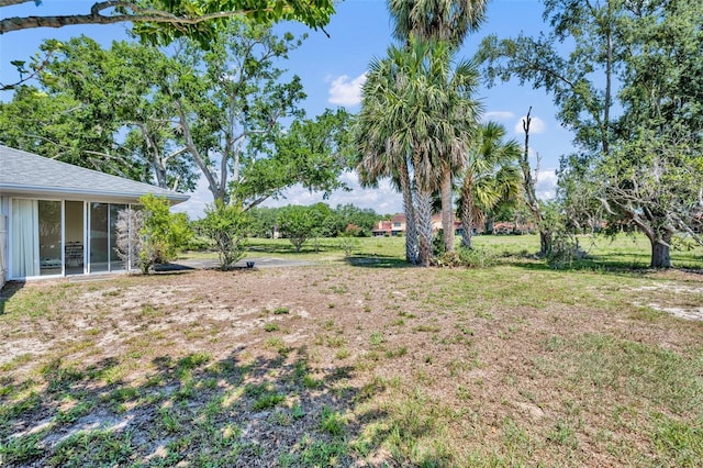 1115 Lake Francis Dr, Apopka, FL 32712 - view of green lawn with a sunroom