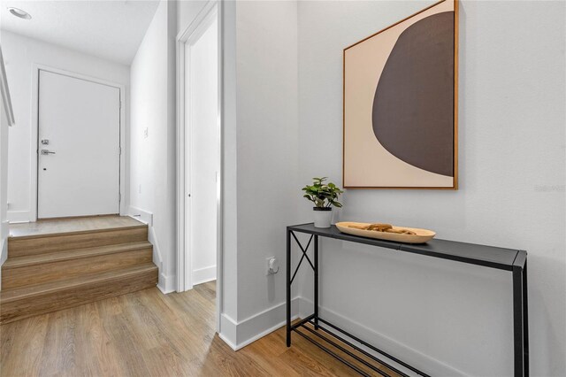 52 W Harding St Unit A, Orlando, FL 32806 - foyer with wood finished floors, baseboards, and stairs