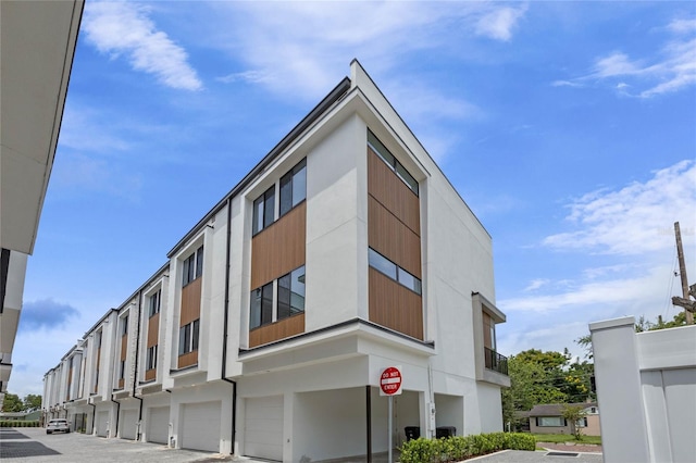 52 W Harding St Unit A, Orlando, FL 32806 - view of property featuring a garage