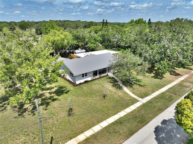 1510 Live Oak St, New Smyrna Beach, FL 32168 - aerial view of property and surrounding area with a heavily wooded area