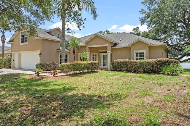 16729 Tall Grass Ln, Clermont, FL 34711 - view of front of home featuring an attached garage, stucco siding, concrete driveway, and a front lawn