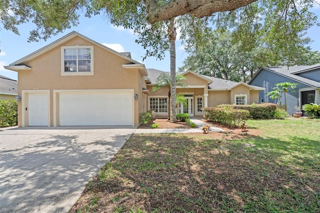 16729 Tall Grass Ln, Clermont, FL 34711 - traditional-style house featuring stucco siding, driveway, an attached garage, and a front yard