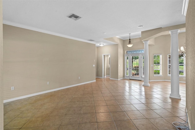16729 Tall Grass Ln, Clermont, FL 34711 - spare room with ornate columns, tile patterned flooring, and crown molding