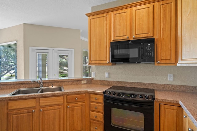 16729 Tall Grass Ln, Clermont, FL 34711 - kitchen with black appliances and brown cabinetry