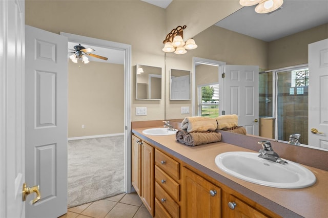 16729 Tall Grass Ln, Clermont, FL 34711 - bathroom with double vanity, a stall shower, a ceiling fan, and tile patterned flooring