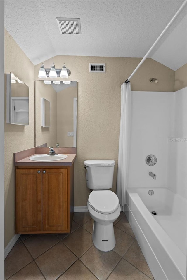 16729 Tall Grass Ln, Clermont, FL 34711 - bathroom featuring lofted ceiling, shower / tub combo, vanity, a textured wall, and tile patterned floors