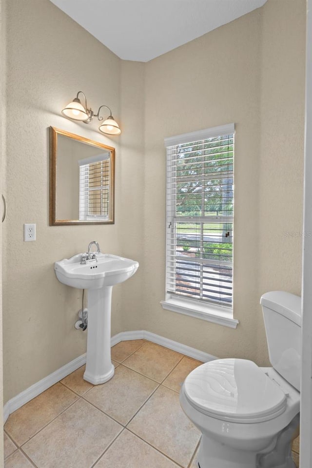 16729 Tall Grass Ln, Clermont, FL 34711 - bathroom featuring tile patterned floors and toilet