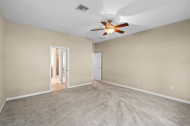 16729 Tall Grass Ln, Clermont, FL 34711 - unfurnished bedroom featuring light colored carpet, ensuite bath, and a ceiling fan