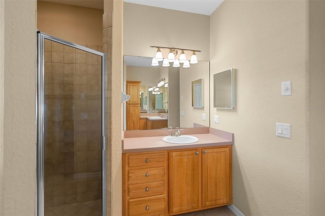 16729 Tall Grass Ln, Clermont, FL 34711 - bathroom with a stall shower, vanity, and a textured wall