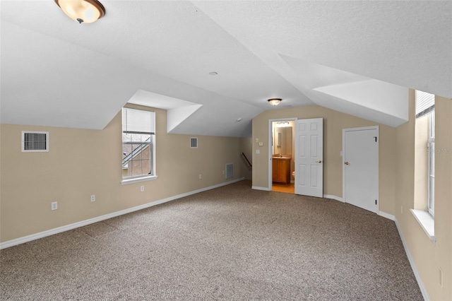 16729 Tall Grass Ln, Clermont, FL 34711 - bonus room featuring carpet floors and lofted ceiling