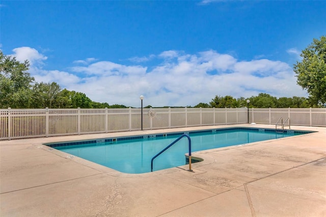 16729 Tall Grass Ln, Clermont, FL 34711 - community pool with a patio area