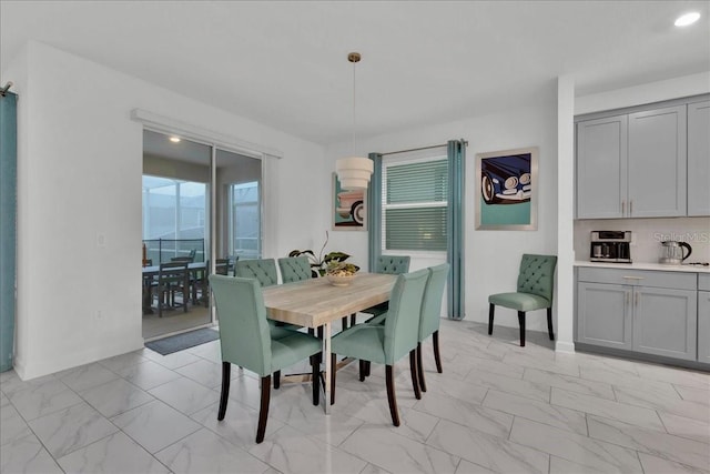 9239 Sommerset Hills Dr, Davenport, FL 33896 - dining area with light marble finish floors and recessed lighting