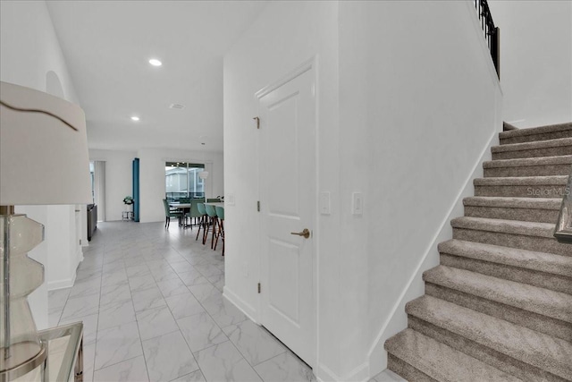 9239 Sommerset Hills Dr, Davenport, FL 33896 - stairs with marble look tile flooring and recessed lighting