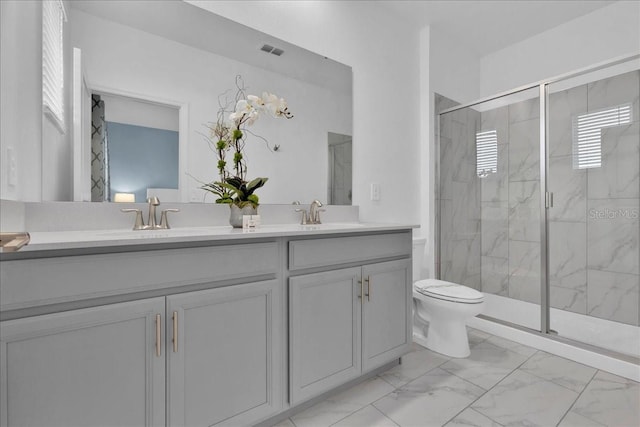 9239 Sommerset Hills Dr, Davenport, FL 33896 - bathroom with marble finish flooring, double vanity, a marble finish shower, and toilet