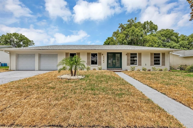 822 Glen Arden Way, Altamonte Springs, FL 32701 - ranch-style home featuring a garage, french doors, driveway, and a front yard
