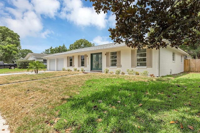 822 Glen Arden Way, Altamonte Springs, FL 32701 - ranch-style home with an attached garage, french doors, and driveway