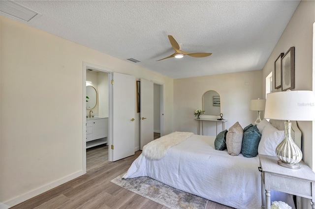 822 Glen Arden Way, Altamonte Springs, FL 32701 - bedroom with wood finished floors, baseboards, a sink, a textured ceiling, and ceiling fan
