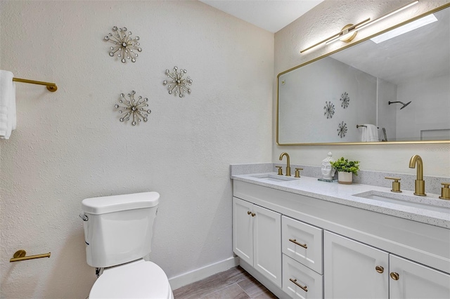 822 Glen Arden Way, Altamonte Springs, FL 32701 - full bathroom with toilet, double vanity, baseboards, and wood finished floors