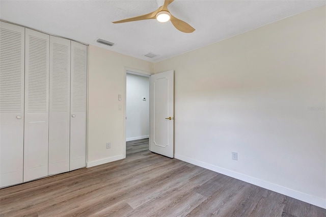 822 Glen Arden Way, Altamonte Springs, FL 32701 - unfurnished bedroom with wood finished floors, baseboards, a closet, and ceiling fan