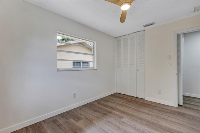 822 Glen Arden Way, Altamonte Springs, FL 32701 - unfurnished bedroom with wood finished floors, a closet, baseboards, and a ceiling fan