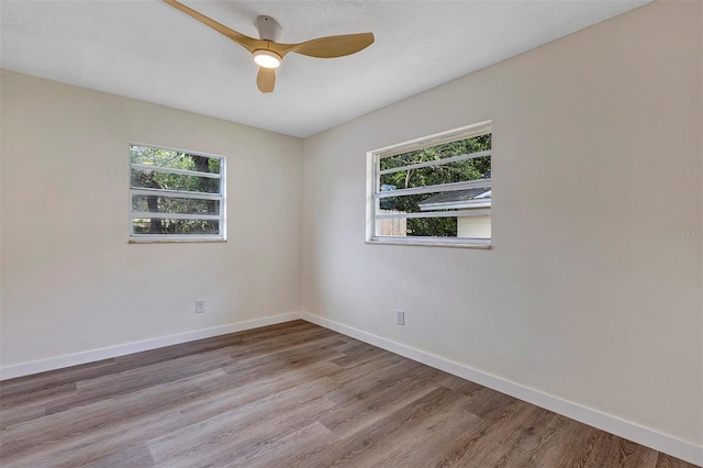 822 Glen Arden Way, Altamonte Springs, FL 32701 - spare room with plenty of natural light, wood finished floors, and baseboards