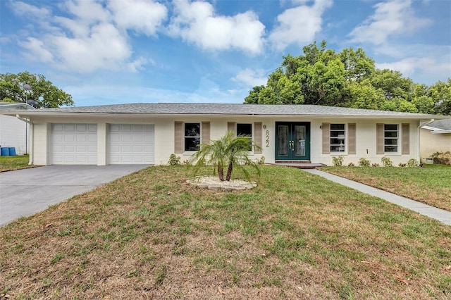 822 Glen Arden Way, Altamonte Springs, FL 32701 - single story home with a garage, driveway, a front lawn, and french doors