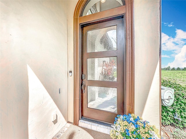 16246 Ravenna Ct, Montverde, FL 34756 - property entrance featuring stucco siding