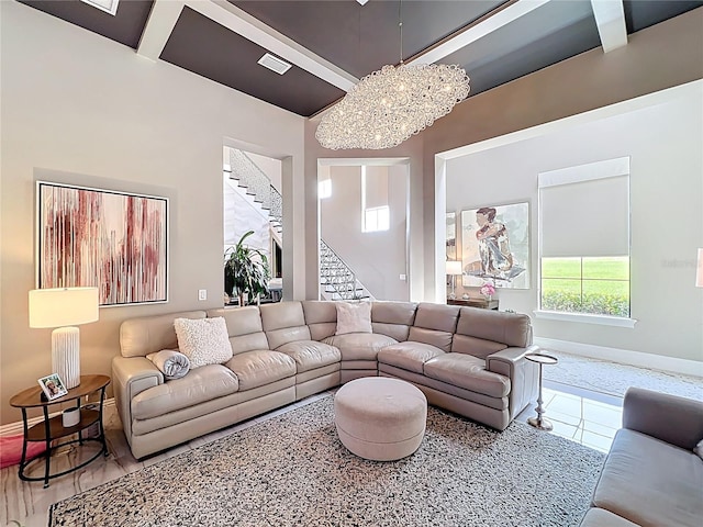 16246 Ravenna Ct, Montverde, FL 34756 - living room with stairs, baseboards, and a chandelier