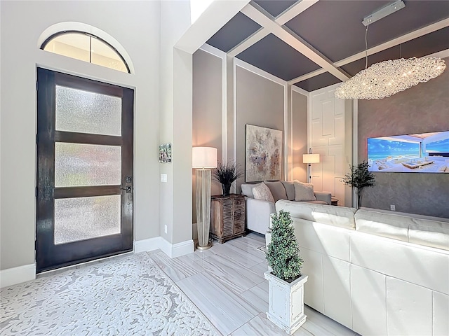 16246 Ravenna Ct, Montverde, FL 34756 - entrance foyer with coffered ceiling, baseboards, and a chandelier