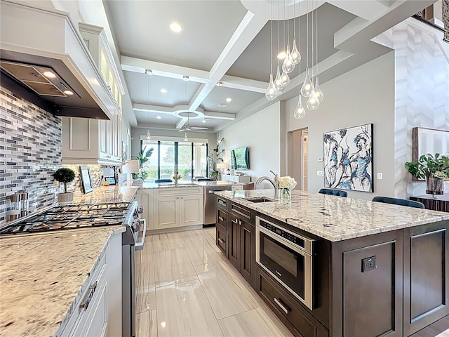 16246 Ravenna Ct, Montverde, FL 34756 - kitchen with premium range hood, stainless steel appliances, coffered ceiling, decorative backsplash, and a sink